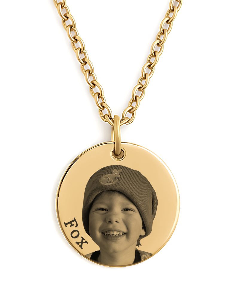 Gold necklace with a pendant featuring a photo of a child and the name 'FOX'.