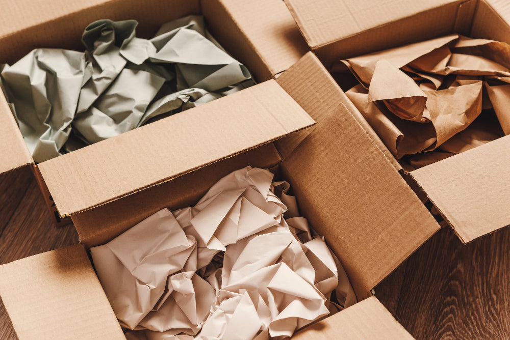 Photo of sustainable cardboard boxes with paper packaging