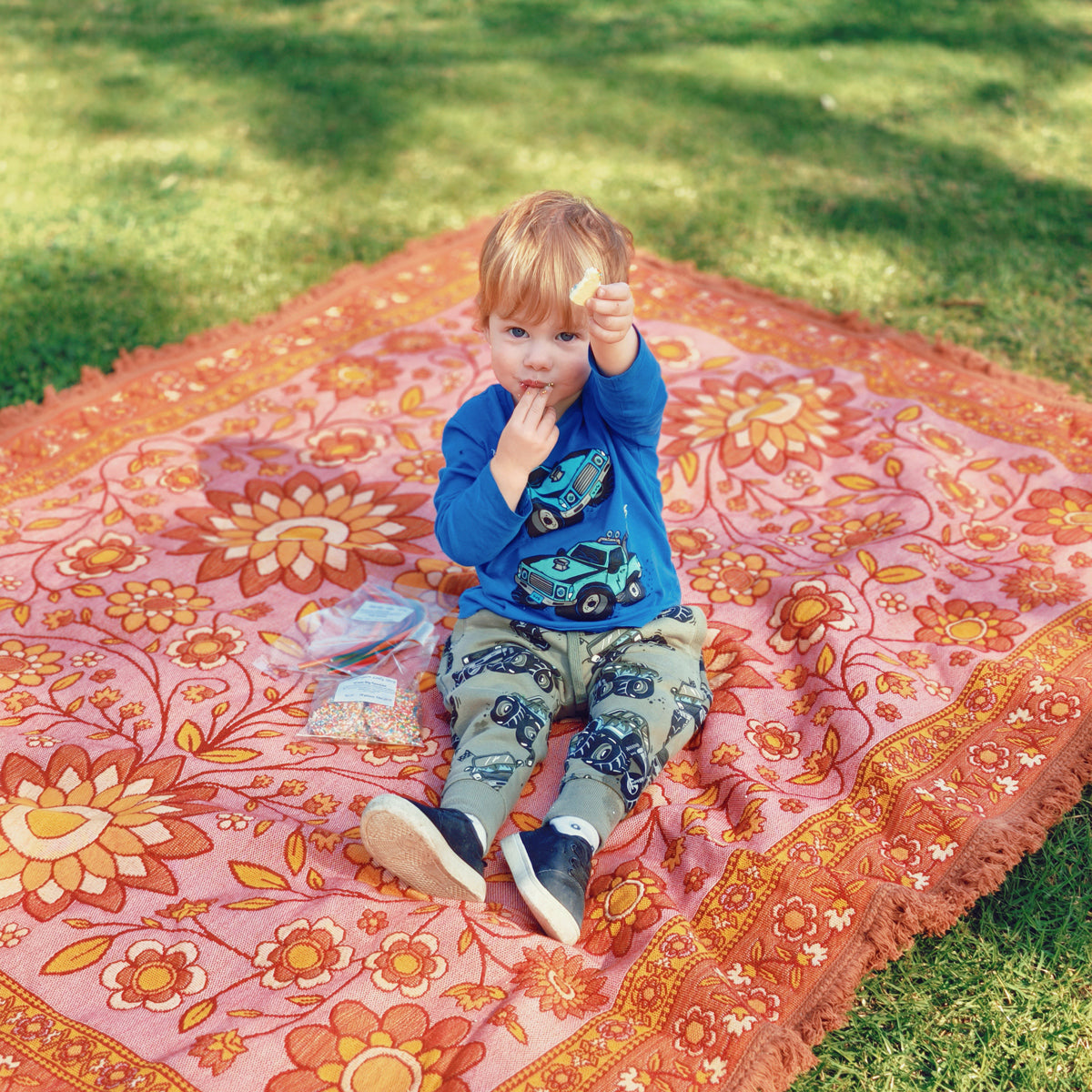 Eating lollies on picnic rug